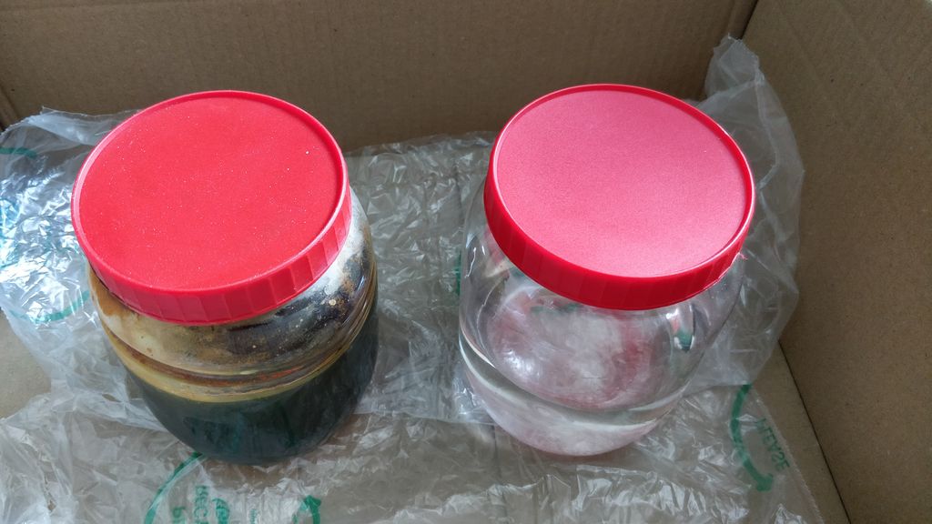 The ferric chloride solution and rinse water in a lined box